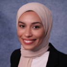 woman wearing head scarf and black jacket