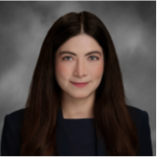 woman with long dark hair wearing black jacket