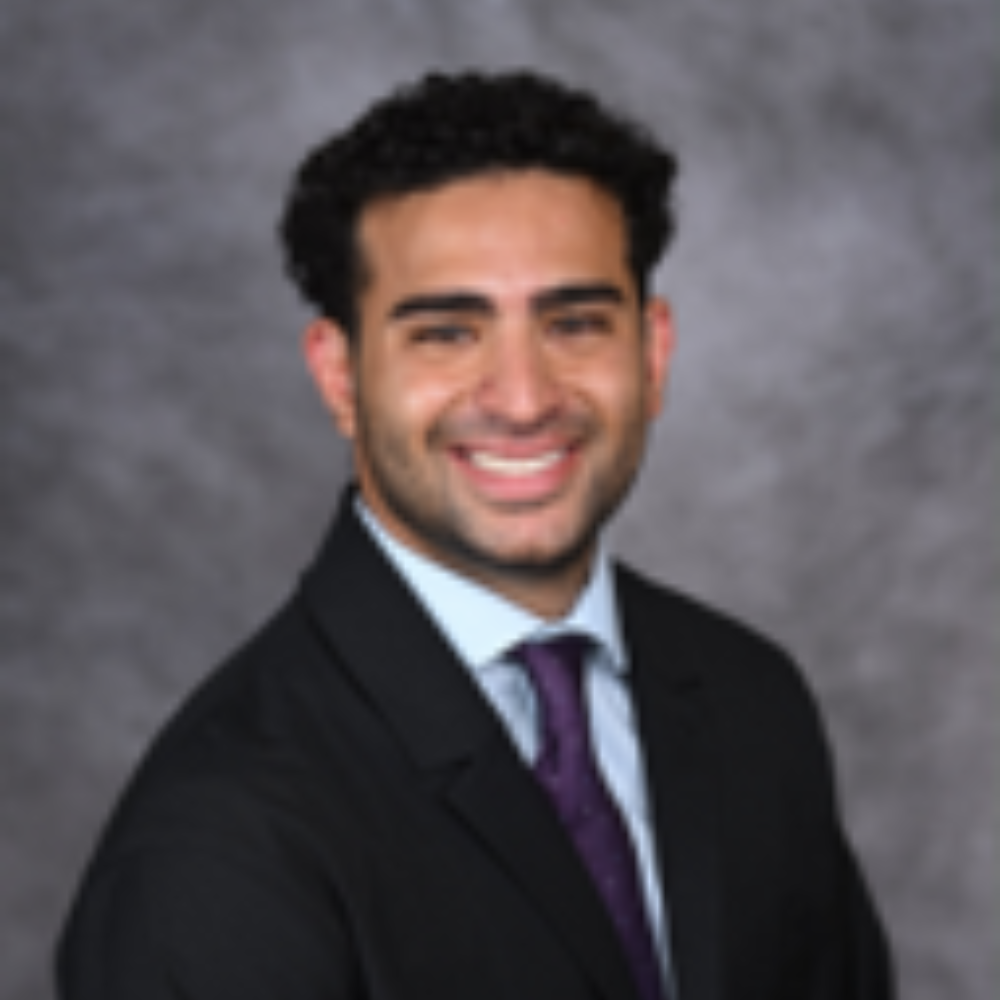 man with dark hair wearing suit