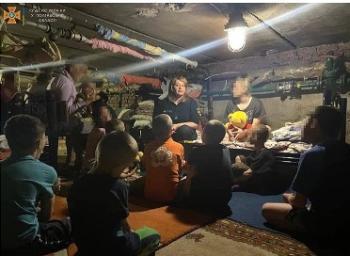 Dr. Tetiana Vatulova teaches Coherent Breathing with a Breath Buddy to calm Ukrainian children in a bomb shelter