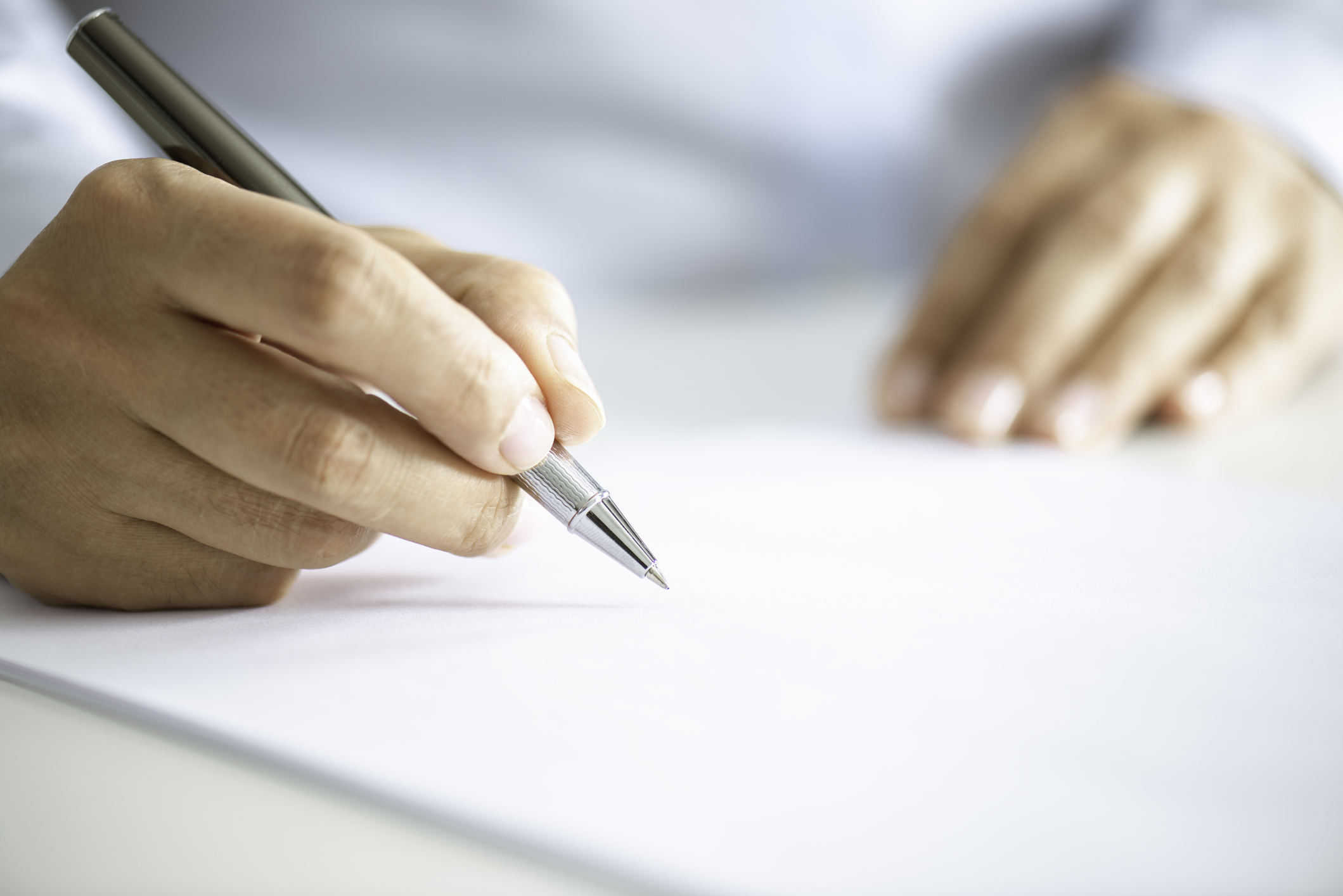 Businessman Signing Contract Paper stock photo.