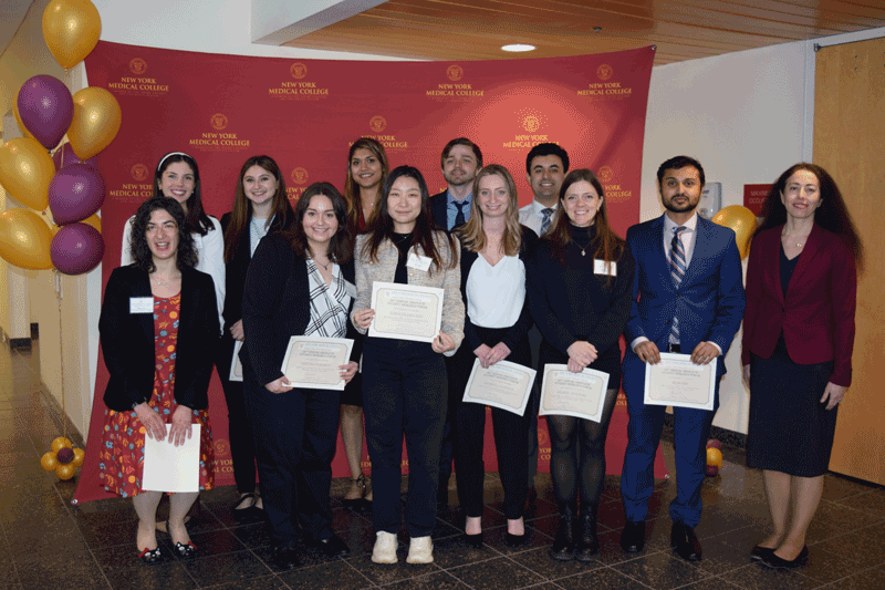 Marina Holz, Ph.D., with research students at the Graduate Student Research Forum.