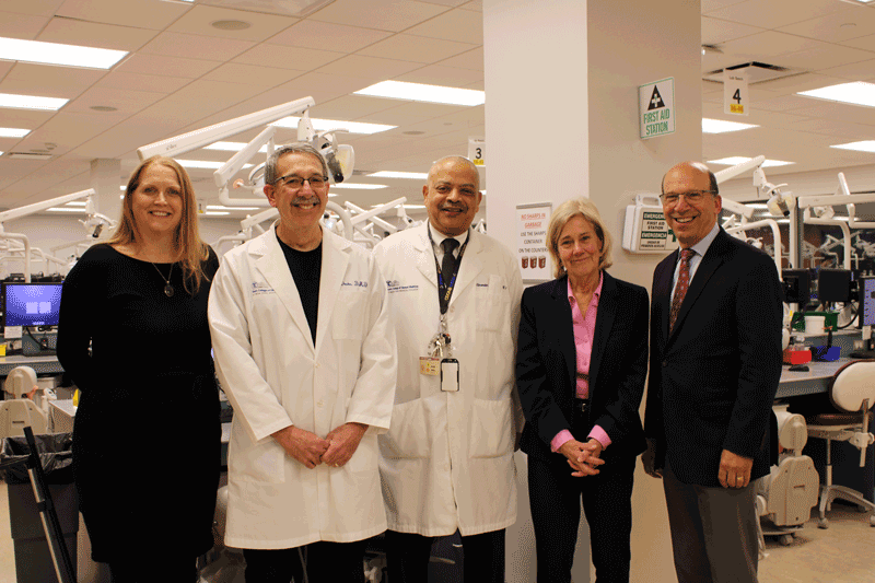 Members of the faculty of NYMC and TCDM stand together with author Mary Otto.