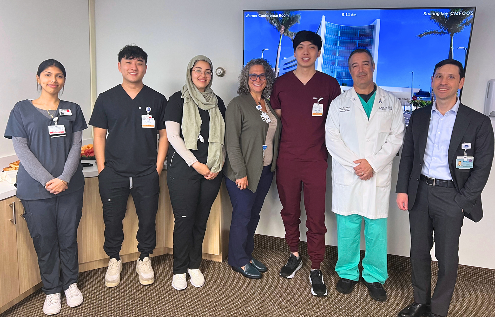 Medical students in scrubs at hospital.