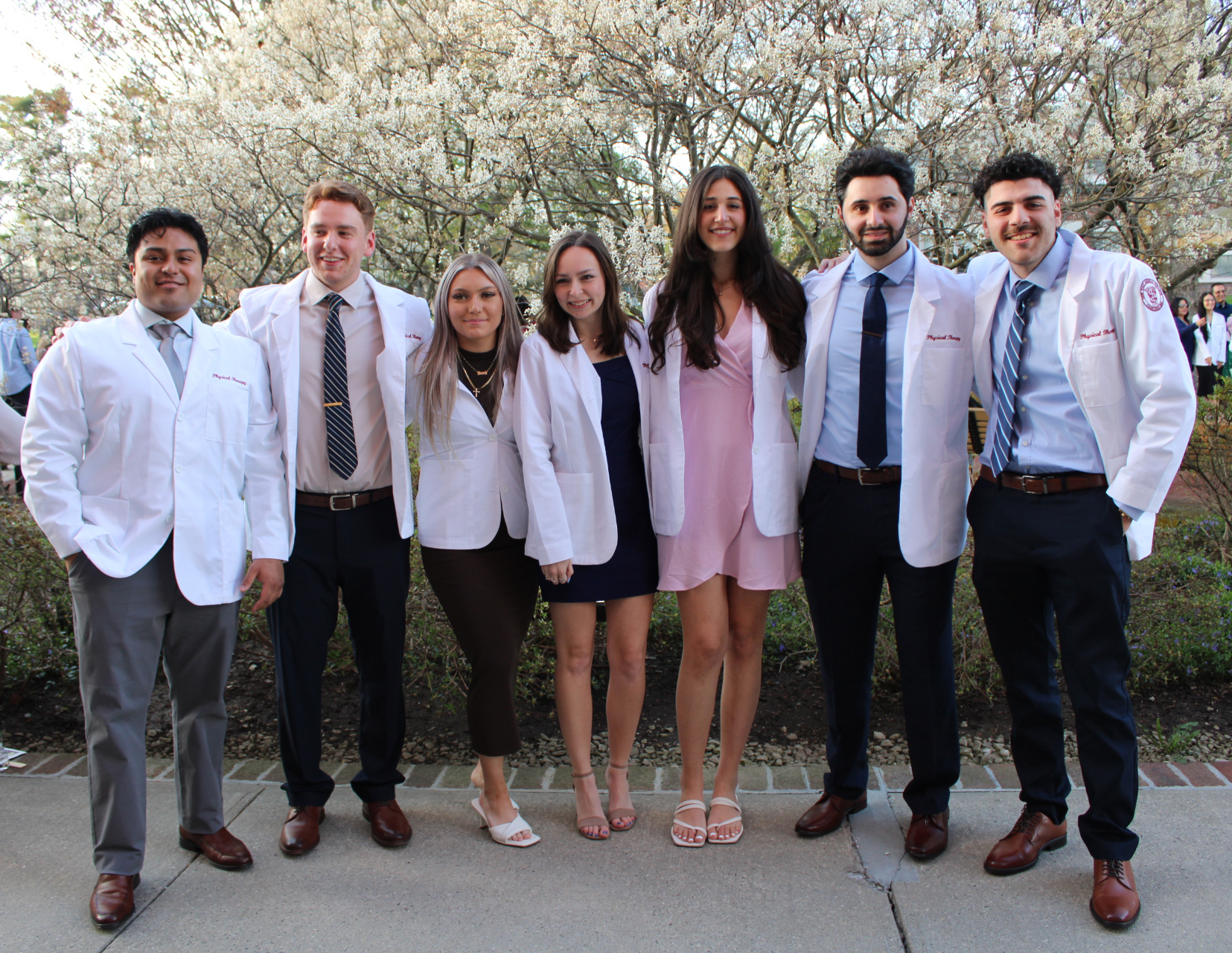 A group of doctorate of physical therapy candidates outside of the Medical Education Center.