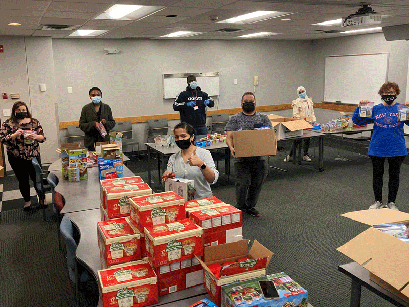 StuHE students collecting food donations to pack nearly 500 meals for Feeding Westchester’s Meals4Kids initiative.