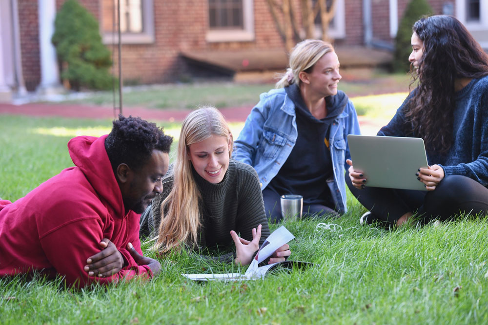 Students Sitting outside on grass