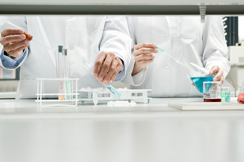 Scientists conducting an experiment stock photo