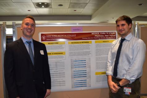 two medical students at Family and Community Medicine Sixth Annual Research Day