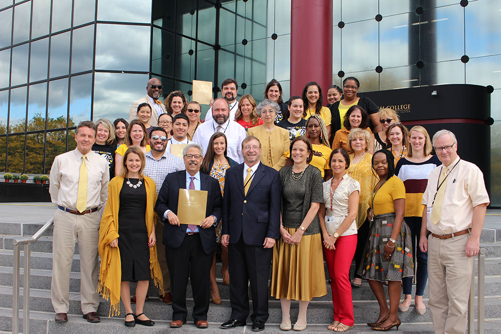 Childhood Cancer Awareness Month Group Headshot where participants are dressed in gold 