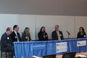 Panelists speaking at program