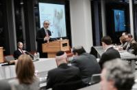 Dr. Kadish at podium speaking to investors at the Trumada Event in February 2018
