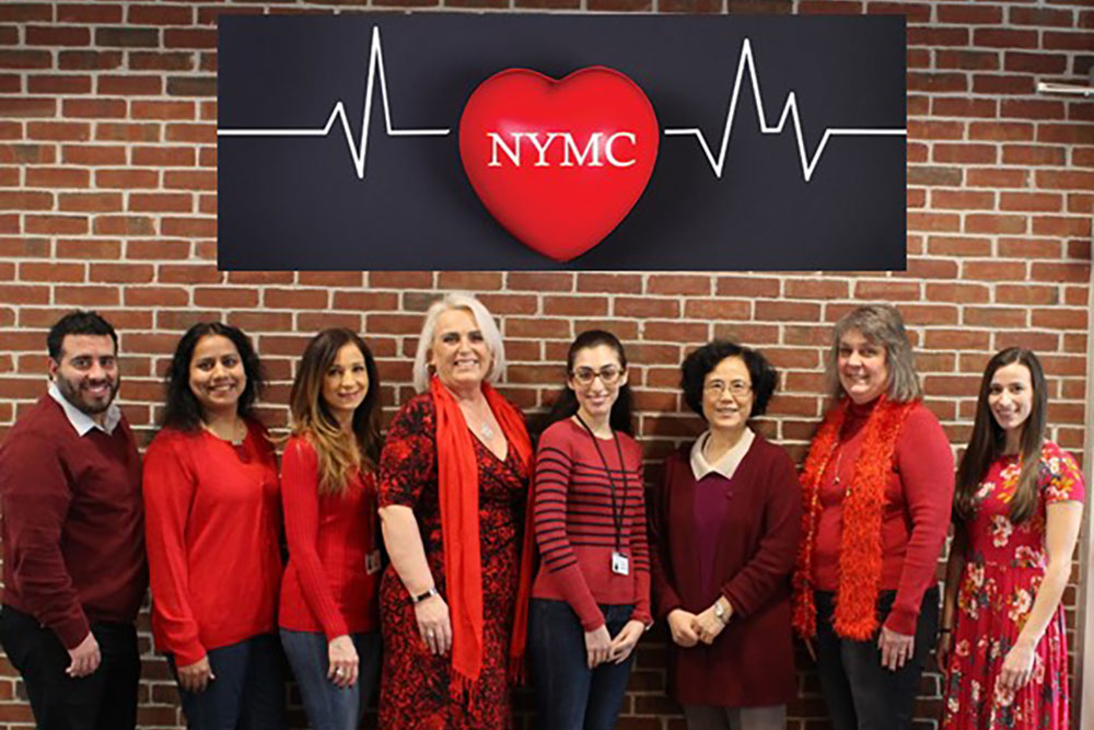 Group headshot of individuals wearing red