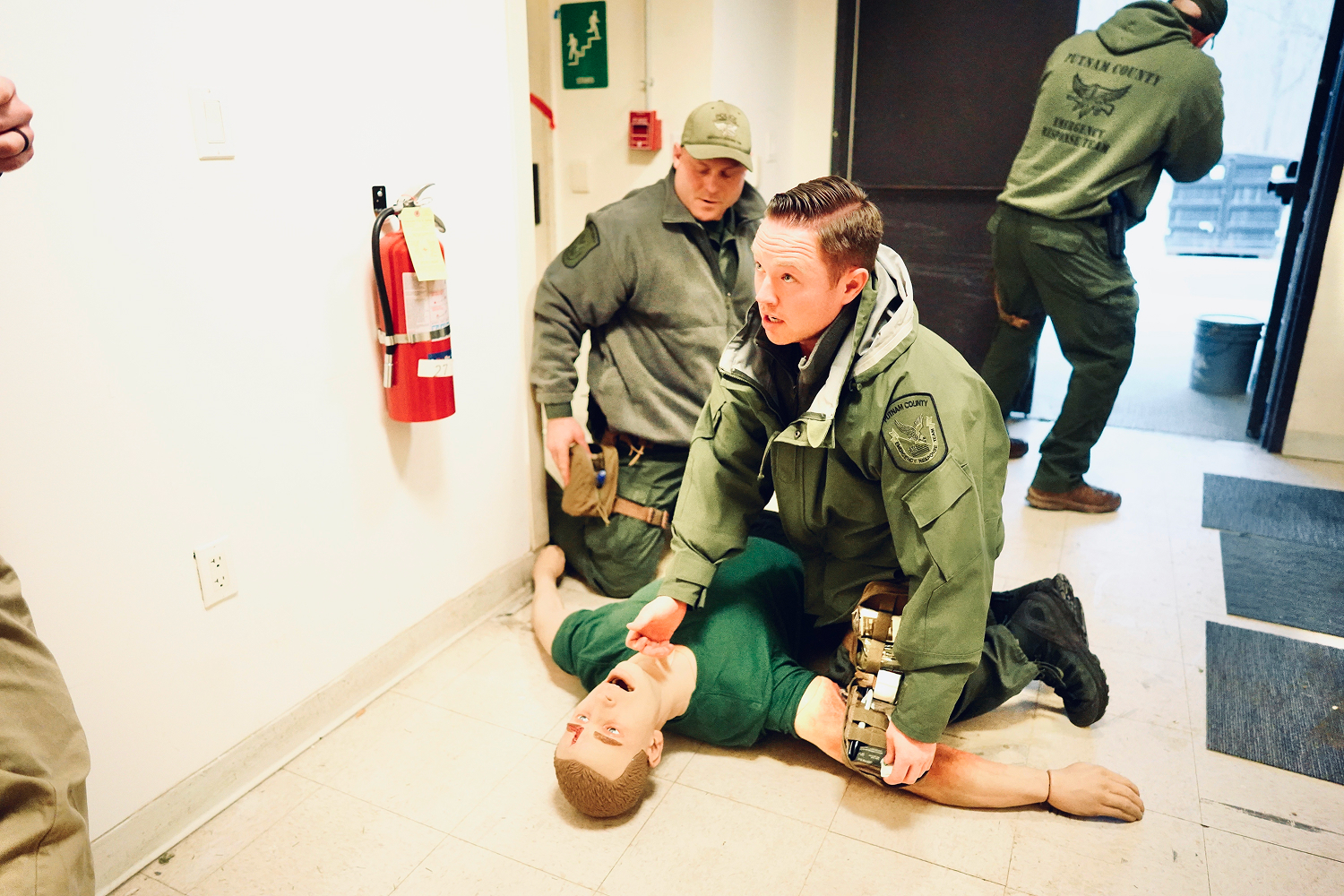 Medical professionals practicing disaster medicine using manikin