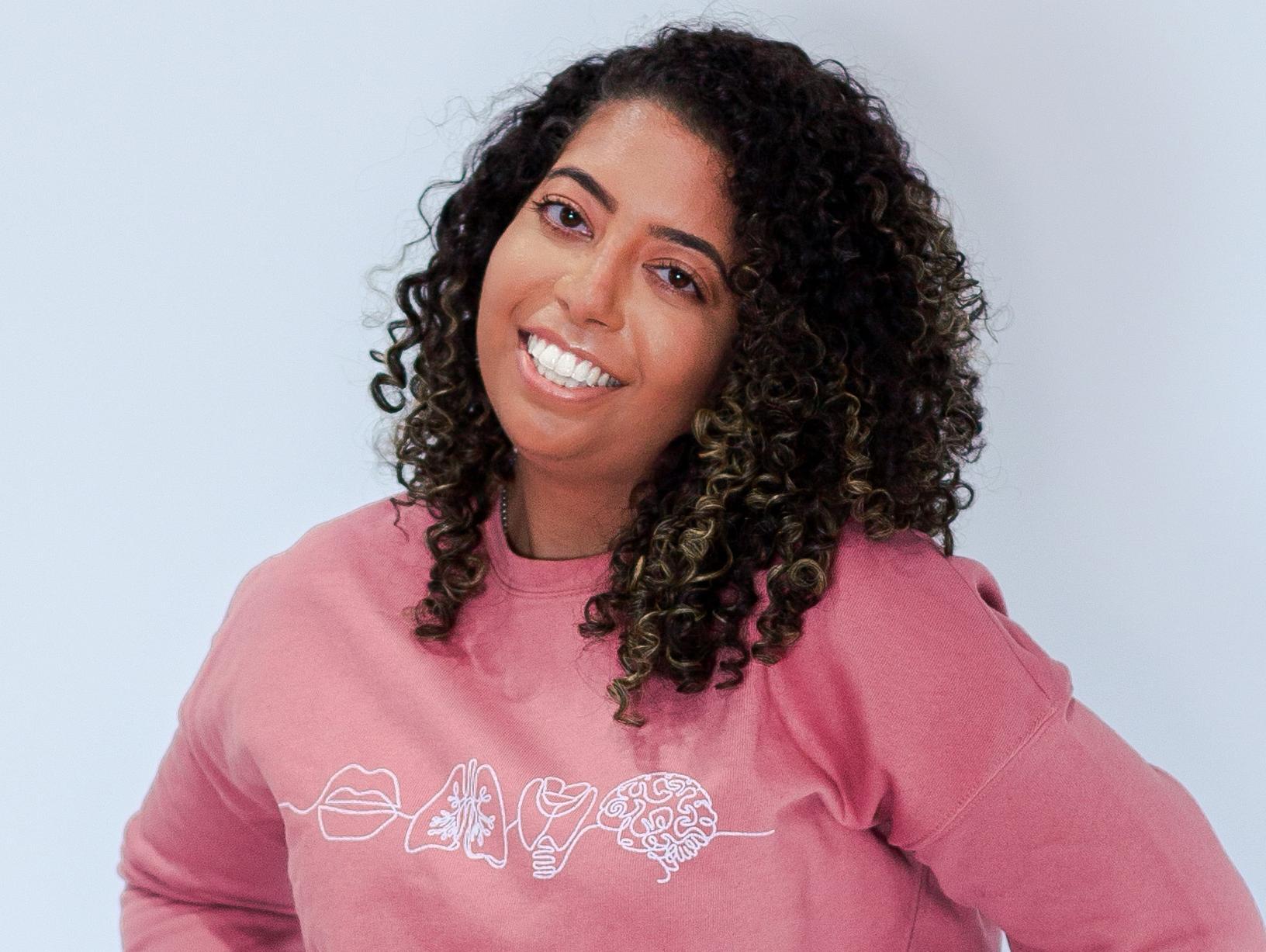 Samantha Walker, M.S., SLP\' 19 in her Speaking of Samantics sweatshirt