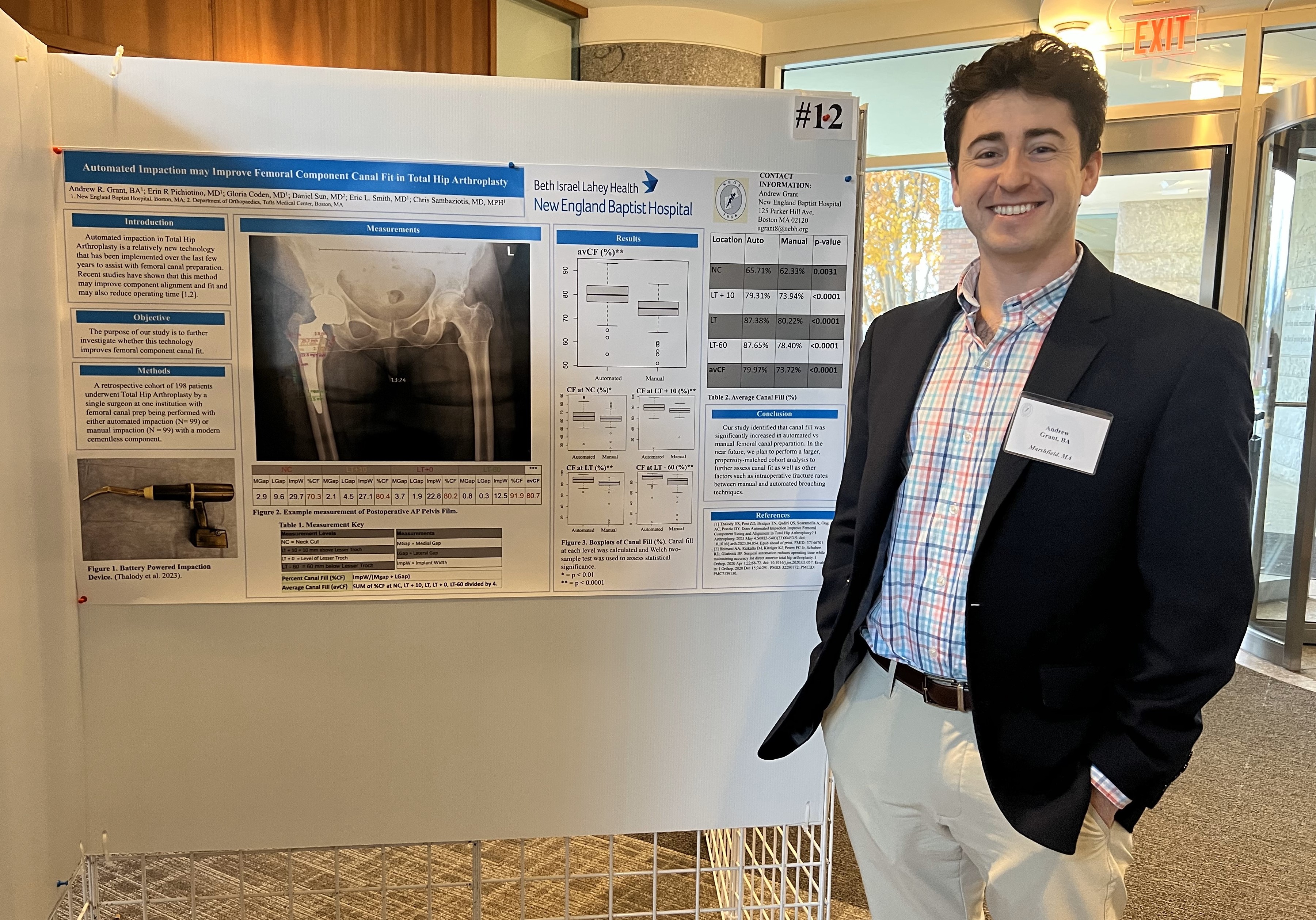 Andrew Grant standing in front of his poster