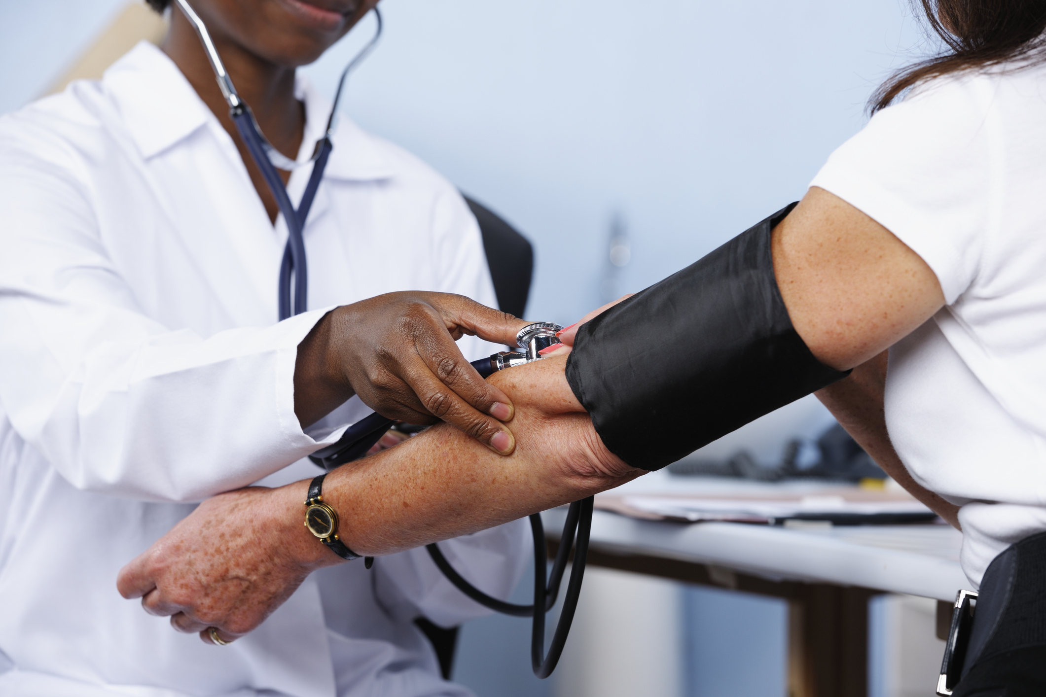 Person Having Blood Pressure Taken by Health Care Professional